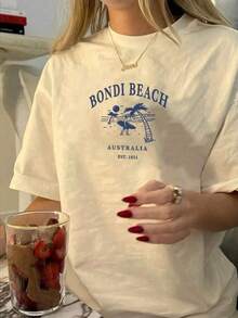 Áo thun nữ cỡ lớn cổ tròn tay ngắn in hình Bondi Beach, kiểu dáng thường ngày, thích hợp mặc mùa hè, thời trang và đa năng, màu mơ, thích hợp cho kỳ nghỉ. - Màu be - Xem 1