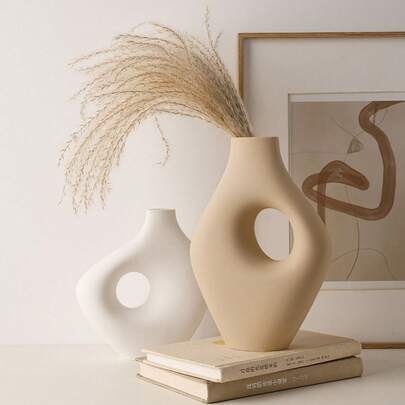 造型独特、色彩柔和的艺术花瓶装饰品。适用于办公室、庭院、家居装饰，也可用作圣诞节挂饰、办公室、情人节/感恩节/圣诞节/复活节/乔迁礼物。干花插花花瓶。