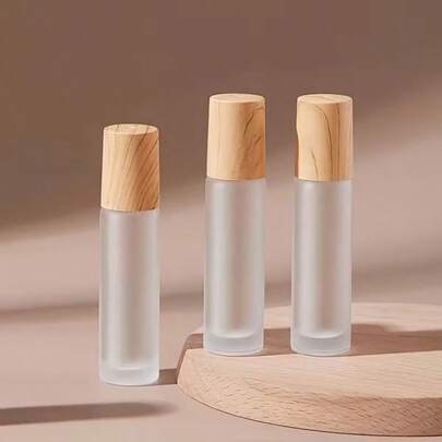 1 pieza Botella de aceite esencial de 10ml, Botella de bola de acero inoxidable portátil para exteriores, Botella de perfume con tapa de grano de madera y frasco de vidrio esmerilado