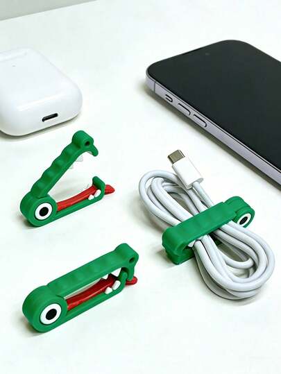 1/2个装创意鳄鱼造型线缆整理器，解决线缆杂乱或打结问题，适用于耳机、手机充电器、鼠标、音频设备、电脑等，迷你小巧，方便携带，是旅行必备工具，也是办公用品、旅行配件、母亲节礼物、返校礼物、毕业礼物和复活节礼物的理想之选。