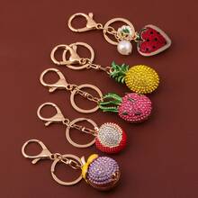 1 chiếc móc khóa/phụ kiện trang trí túi xách hình trái cây giả đính đá lấp lánh dễ thương: dứa, dâu tây, thanh long, vải. - Nhiều màu - Xem 7