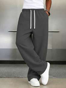 1 chiếc quần dài nam dáng rộng, màu trơn, có dây rút ở eo và túi lớn, thích hợp cho đi bộ hàng ngày, đi làm, du lịch và các dịp khác. - Màu xám đen - Xem 2