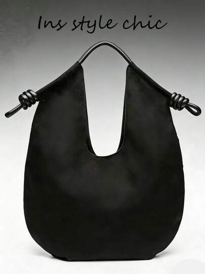 Chiếc túi xách đeo vai/cầm tay màu đen trơn hiệu Niche này là một phụ kiện thời trang và tinh tế. Thiết kế khóa nam châm kết hợp giữa thời trang và tính практичность, khiến nó trở nên hoàn hảo cho việc đi lại hàng ngày và lý tưởng cho du lịch và mua sắm.