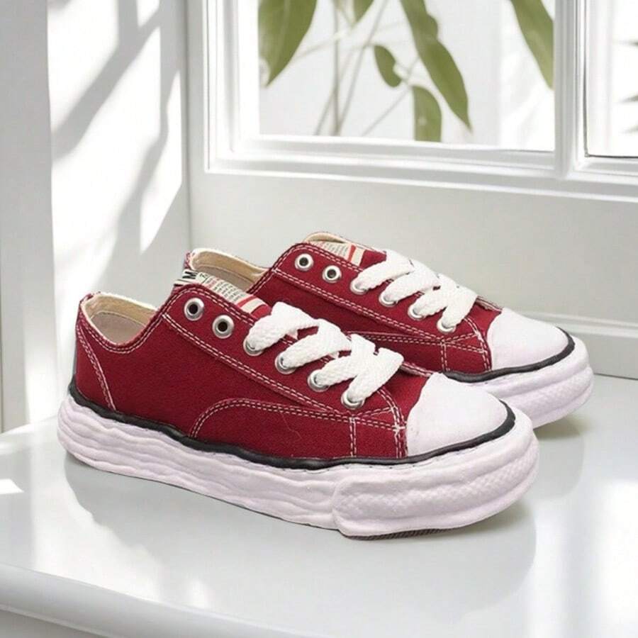 Klassische Skateschuhe aus Canvas im Eiscreme-Stil von MMY mit geschmolzenen Sohlen und Zehenkappen – lässige Retro-Canvas-Schuhe, die sich für Paare eignen.