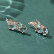 一对优雅的玫瑰金耳环，镶嵌椭圆形合成海蓝宝石和纯锆石，设计精致百搭，日常佩戴舒适，也适合婚礼和正式场合，是女士的奢华珠宝之选。 - 淺藍色 - 查看 8