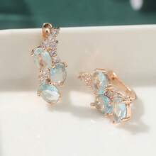 一对优雅的玫瑰金耳环，镶嵌椭圆形合成海蓝宝石和纯锆石，设计精致百搭，日常佩戴舒适，也适合婚礼和正式场合，是女士的奢华珠宝之选。 - 淺藍色 - 查看 6