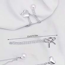 2 chiếc kẹp ống quần denim hình trái tim/nơ đính ngọc trai giả, dùng để tránh ống quần bị kéo lê trên mặt đất, khóa giày chống trượt, điều chỉnh độ dài quần, ngăn ống quần chạm đất, phù hợp với quần jean và quần dài. - A - Xem 12