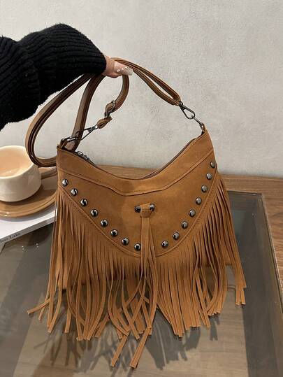 1 chiếc túi xách nữ màu trơn, thêu họa tiết, đính đinh tán, tua rua, có khóa kéo, rất cần thiết cho việc mua sắm và du lịch.