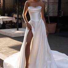 Elegant Strapless Satin A-Line Wedding Dress With High Side Slit, Hand-Applied Pearl Bodice, And Detachable Sweep Train – Premium Soft Satin With Delicate Pearl Beading, Fitted Corset Waist, Flowing A-Line Skirt With High Thigh Slit And Detachable Sweep Train, Available In Ivory – Perfect For Spring/Summer Beach Weddings, Garden Ceremonies, And Destination Weddings, Lightweight And Breezy Design, Ideal For Warm Weather, International Export Quality, Suitable For Global Bridal Market - Blanco - Ver 6