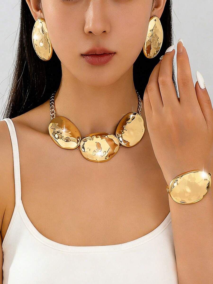 Bộ 4 món mạ vàng dáng oval, thiết kế nổi bật, gồm dây chuyền, bông tai và vòng tay, thích hợp cho nữ mặc hàng ngày và dự tiệc. - Vàng - Xem 1
