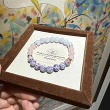 一套9条神奇水晶手链，象征着和平、财富、繁荣、友谊、好运、爱情和守护。水晶珠带来乐观积极、自信和力量，弹性手链，适合作为送给男友/女友的礼物。 - 多色 - 查看 12