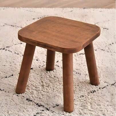 One Wooden Stool, In Modern Walnut Color And Nordic Wood Tone, With Strong Load-Bearing Capacity. It Is A Fully Solid Square-Shaped Small Chair, Suitable For Home Study Rooms, Bedrooms, Living Rooms, Kitchens, Bathrooms, And Entrance Areas Of Hallways.