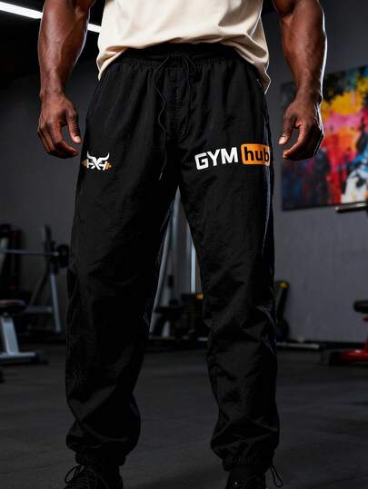 男士字母印花抽绳腰休闲多功能日常户外运动裤，直筒抽绳款式，小巧印花，适合所有季节，健身房、运动、休闲裤