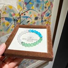 一套9条神奇水晶手链，象征着和平、财富、繁荣、友谊、好运、爱情和守护。水晶珠带来乐观积极、自信和力量，弹性手链，适合作为送给男友/女友的礼物。 - 多色 - 查看 13