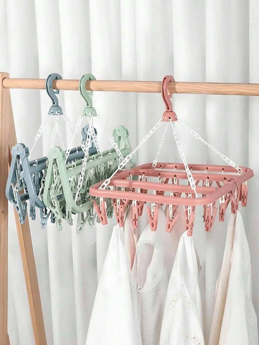 OBOVAY 1 pieza Percha colgante multifuncional, diseño ahorra espacio, plegable, con 32 pinzas, conveniente para almacenar y secar ropa, secadora multifuncional, pinzas de plástico para el hogar, percha con múltiples pinzas, puede colgar ropa y calcetines, artículo esencial para el hogar, almacenamiento de viaje (Nota: El desprendimiento de las pinzas durante el transporte es un fenómeno normal y no afecta la calidad del producto; las pinzas desprendidas se pueden volver a instalar y usar). - Multicolor - Ver 1