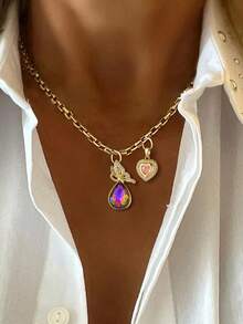 Bộ dây chuyền mặt dây chuyền nữ gồm 1 chiếc, với các mặt dây chuyền hình bướm giọt nước, mặt dây chuyền hình ngôi sao và trái tim màu hồng, mặt dây chuyền hình trái tim, mặt dây chuyền hình trái tim đính đá, mặt dây chuyền hình lục giác và mặt dây chuyền hình hành tinh. Thiết kế thanh lịch và dễ thương, phù hợp để đeo hàng ngày, kiểu dáng đa năng, cũng là một món quà hoàn hảo. - Vàng - Xem 10