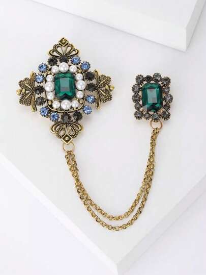 1件复古流苏胸针，饰有祖母绿宝石链，可作西装/外套配饰