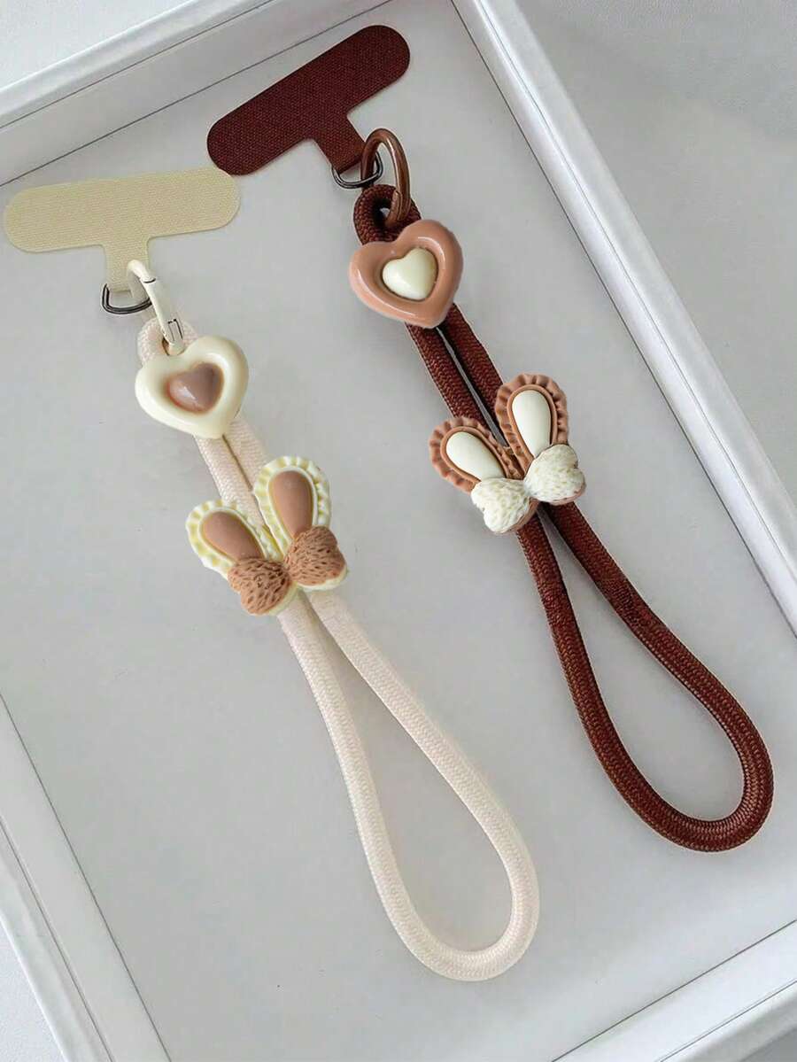 1 chiếc dây đeo cổ tay điều chỉnh được hình trái tim màu nâu và be trang nhã, có nơ trang trí, dùng cho điện thoại. - Nhiều màu - Xem 1