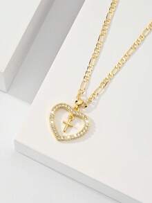 Dây chuyền thánh giá dành cho nữ với khung hình trái tim và đá Zirconia đính kèm, nhỏ nhắn và tinh tế với kết cấu mịn, đá Zirconia lấp lánh và chắc chắn, lý tưởng để làm quà tặng và đeo hàng ngày, tượng trưng cho sự bảo vệ và tình yêu. - Vàng - Xem 2