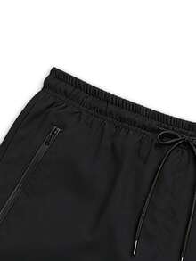 Quần short tập luyện nam dáng rộng, nhanh khô, có in chữ phản quang và túi khóa kéo, thoáng khí và thoải mái, phù hợp cho các bài tập trong phòng gym và các môn thể thao chạy đường dài ngoài trời. - màu đen - Xem 8