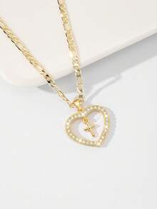 Dây chuyền thánh giá dành cho nữ với khung hình trái tim và đá Zirconia đính kèm, nhỏ nhắn và tinh tế với kết cấu mịn, đá Zirconia lấp lánh và chắc chắn, lý tưởng để làm quà tặng và đeo hàng ngày, tượng trưng cho sự bảo vệ và tình yêu. - Vàng - Xem 4