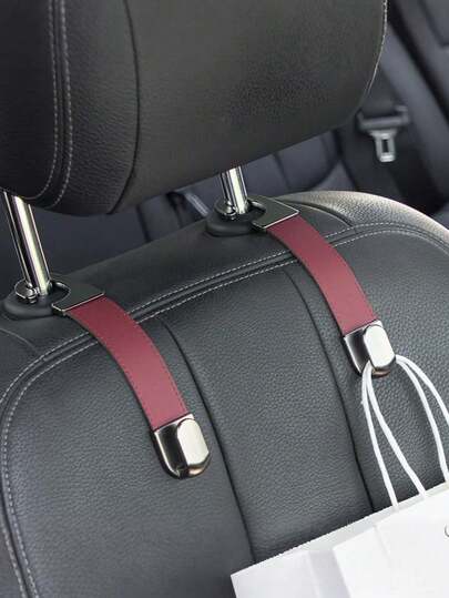 Móc treo lưng ghế ô tô có thể gập lại với dây đeo da – Móc treo kim loại chắc chắn cho tựa đầu – Giá đỡ đa năng chống trầy xước cho túi xách, ba lô và đồ tạp hóa – Ngăn chứa đồ ẩn cho ghế sau – Phụ kiện nội thất ô tô lý tưởng