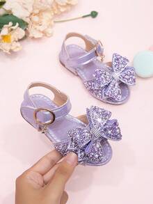 Giày sandal mới năm 2026 cho bé gái, giày công chúa cho trẻ em với nơ đính đá, giày đi biển cho bé gái học sinh, giày mùa hè. - Màu tím - Xem 1