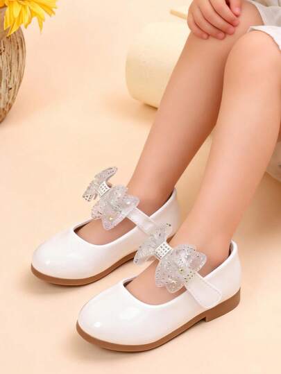 1 đôi giày Mary Jane da bóng màu trắng và hồng mới cho bé gái, đính đá lấp lánh, nơ lưới, đế mềm chống trơn trượt, thích hợp cho hoạt động ngoài trời và biểu diễn, mùa xuân/thu.
