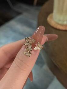 5件套奢华优雅盛开花朵和蝴蝶镶嵌立方氧化锆戒指套装，可调节铜戒指，适合日常、派对、度假佩戴（不含礼盒） - 金黃色 - 查看 8