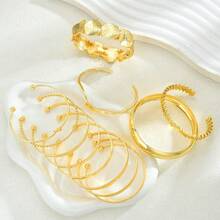 Bộ 12 chiếc vòng tay hở cổ tay kẻ sọc bất đối xứng, thiết kế lá cách điệu, bộ vòng tay thanh lịch, thích hợp làm quà tặng ngày lễ và đeo hàng ngày. - Vàng - Xem 2