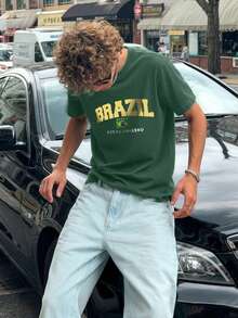 男士图案T恤，复西足球球衣，休闲足球迷装扮，足球衫，100%聚酯纤维透气针织面料，常规版型圆领设计 - 墨綠色 - 查看 1