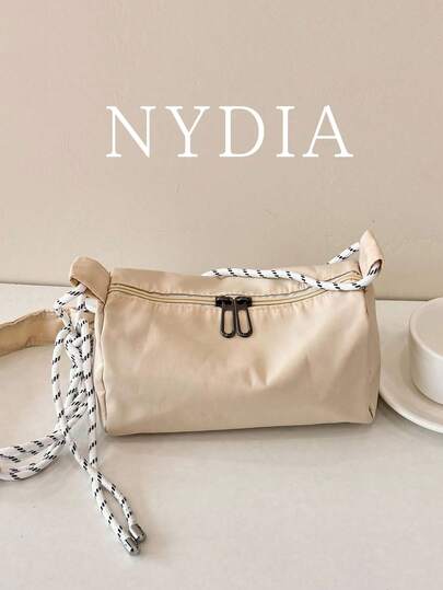 1个休闲抽绳装饰圆筒斜挎包，简约多功能女士通勤单肩包