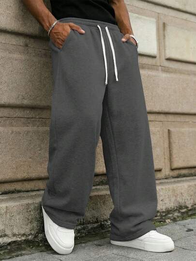 男士休闲运动裤，宽松直筒版型，垂坠感强，适合居家休闲和户外活动。也可作为情侣礼物赠送。采用100%涤纶面料，配有抽绳腰带，可调节松紧，多种颜色可选。春季款