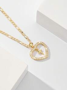 Dây chuyền thánh giá dành cho nữ với khung hình trái tim và đá Zirconia đính kèm, nhỏ nhắn và tinh tế với kết cấu mịn, đá Zirconia lấp lánh và chắc chắn, lý tưởng để làm quà tặng và đeo hàng ngày, tượng trưng cho sự bảo vệ và tình yêu. - Vàng - Xem 1