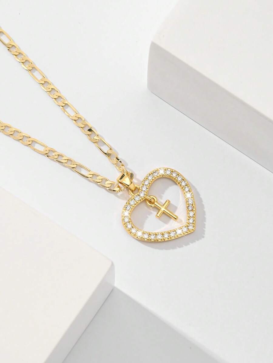 Dây chuyền thánh giá dành cho nữ với khung hình trái tim và đá Zirconia đính kèm, nhỏ nhắn và tinh tế với kết cấu mịn, đá Zirconia lấp lánh và chắc chắn, lý tưởng để làm quà tặng và đeo hàng ngày, tượng trưng cho sự bảo vệ và tình yêu. - Vàng - Xem 1