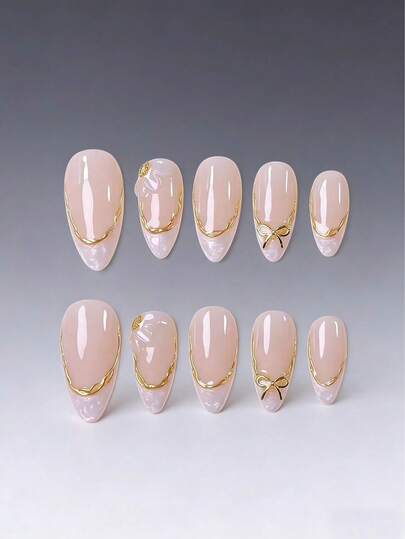 10pcs/Set Handmade Nail Stickers Kit, Featuring Nude Base Color, Elegant Gold Wave Trim, Delicate 3D Bow Decor, And Gentle Ombre French Tips. Designed In Elongated Almond Shape For Comfortable Everyday Wear, Delivering Salon-Level Perfection. Press On Nails