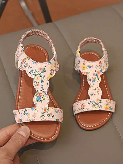 1双女童碎花波浪镂空弹力后跟带PU皮防滑耐磨露趾平底凉鞋，甜美公主风，适合日常穿着、上学、购物、户外活动、海滩度假、儿童节、生日等场合，亦可作为礼物赠送。