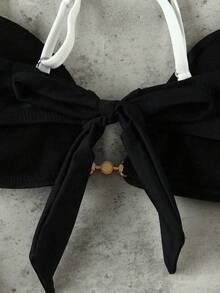 Bộ bikini phong cách sao nổi tiếng sang trọng, thanh lịch, gợi cảm, phối màu đen trắng tương phản, thích hợp cho kỳ nghỉ biển và các sự kiện, thời trang, với viền trang trí bằng vòng kim loại. - Nhiều màu - Xem 4