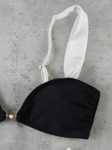 Bộ bikini phong cách sao nổi tiếng sang trọng, thanh lịch, gợi cảm, phối màu đen trắng tương phản, thích hợp cho kỳ nghỉ biển và các sự kiện, thời trang, với viền trang trí bằng vòng kim loại. - Nhiều màu - Xem 5