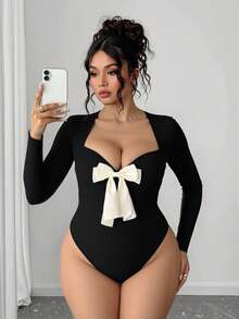 Áo liền thân dài tay bằng vải dệt kim thắt nơ dành cho nữ, màu đen. - màu đen - Xem 1