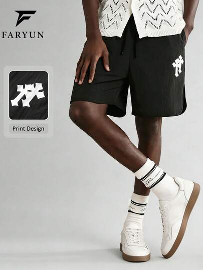 男士宽松直筒侧开衩交叉印花休闲短裤，适合休闲外出、街头穿搭、聚会和度假穿着。