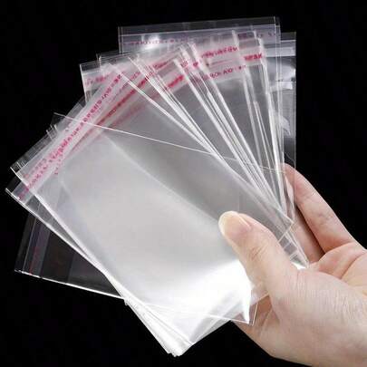 50pcs Transparent Plastic Self-Adhesive Bags, Suitable For Jewelry, Groceries, Data Cables, Phone Case Packaging And Storage, Practical And Convenient For Personal Use And Small Business Supplies, Seasonal Clothing, Jeans, Coats, Quilts, Blankets, Pillows Dust-Proof, Toys, Home Goods Storage, Portable Foldable Clothing Storage Bags, Bedroom Closet Organizer Bags, Foldable Design, Space-Saving