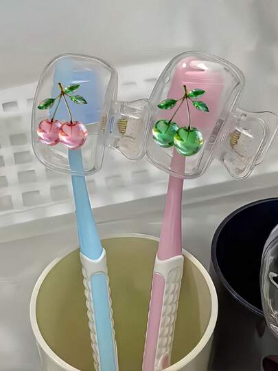 2 portacepillos de dientes con diseño lindo de cerezas de cristal rosa y verde, organizador de almacenamiento para el hogar y viajes con tapa transparente, diseño compacto y portátil para un fácil transporte, protege la cabeza del cepillo de dientes, con doble orificio para drenaje y ventilación, ideal para el hogar, dormitorio y uso en movimiento