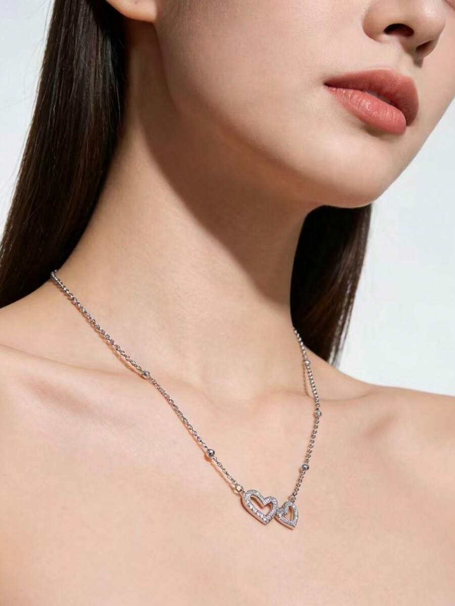 1 chiếc vòng cổ đính đá hình trái tim đôi sang trọng, thiết kế độc đáo dạng vòng cổ nhiều lớp, phù hợp cho phụ nữ đeo hàng ngày. - Bạc - Xem 1