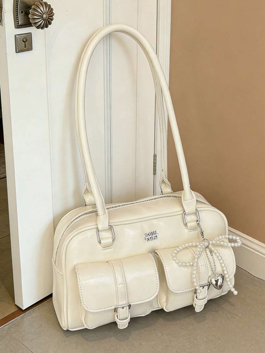 这是一款经典、时尚且多功能的包袋，采用纯色PU材质制成。它拥有多个口袋，可用作手提包、单肩包或腋下配饰，适合旅行、购物、通勤、聚会、约会和新年装扮等场合。