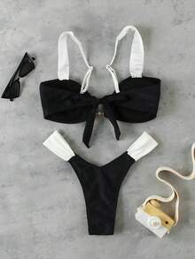Bộ bikini phong cách sao nổi tiếng sang trọng, thanh lịch, gợi cảm, phối màu đen trắng tương phản, thích hợp cho kỳ nghỉ biển và các sự kiện, thời trang, với viền trang trí bằng vòng kim loại. - Nhiều màu - Xem 3