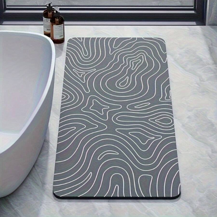 Thảm phòng tắm chống trượt họa tiết hình học, sợi ngắn, vải polyester dệt với lớp đế cao su. Thảm silicon mỏng, mềm mại, nhanh khô, thích hợp cho bồn tắm, khu vực vòi sen và lối vào. Màu xám.