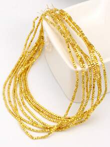 Một món phụ kiện tự làm như vòng tay, vòng cổ hoặc bông tai được làm từ hạt đá hematit hình vuông 2mm, ngăn cách bởi các hạt đệm, tỏa sáng nhờ chất liệu thủ công. - Nhiều màu - Xem 5