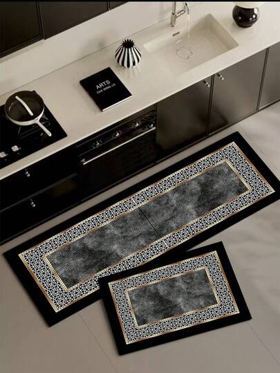 1 tấm thảm bếp bằng gel silica, thiết kế viền theo phong cách Hồi giáo sang trọng, nền đen với họa tiết sọc xám ở trung tâm, bao quanh là họa tiết hình học rỗng màu trắng tinh tế theo phong cách Hồi giáo với viền vàng, toát lên vẻ huyền bí, thanh lịch và cao cấp, phù hợp với những ngôi nhà theo phong cách sang trọng, cổ điển hoặc độc đáo.