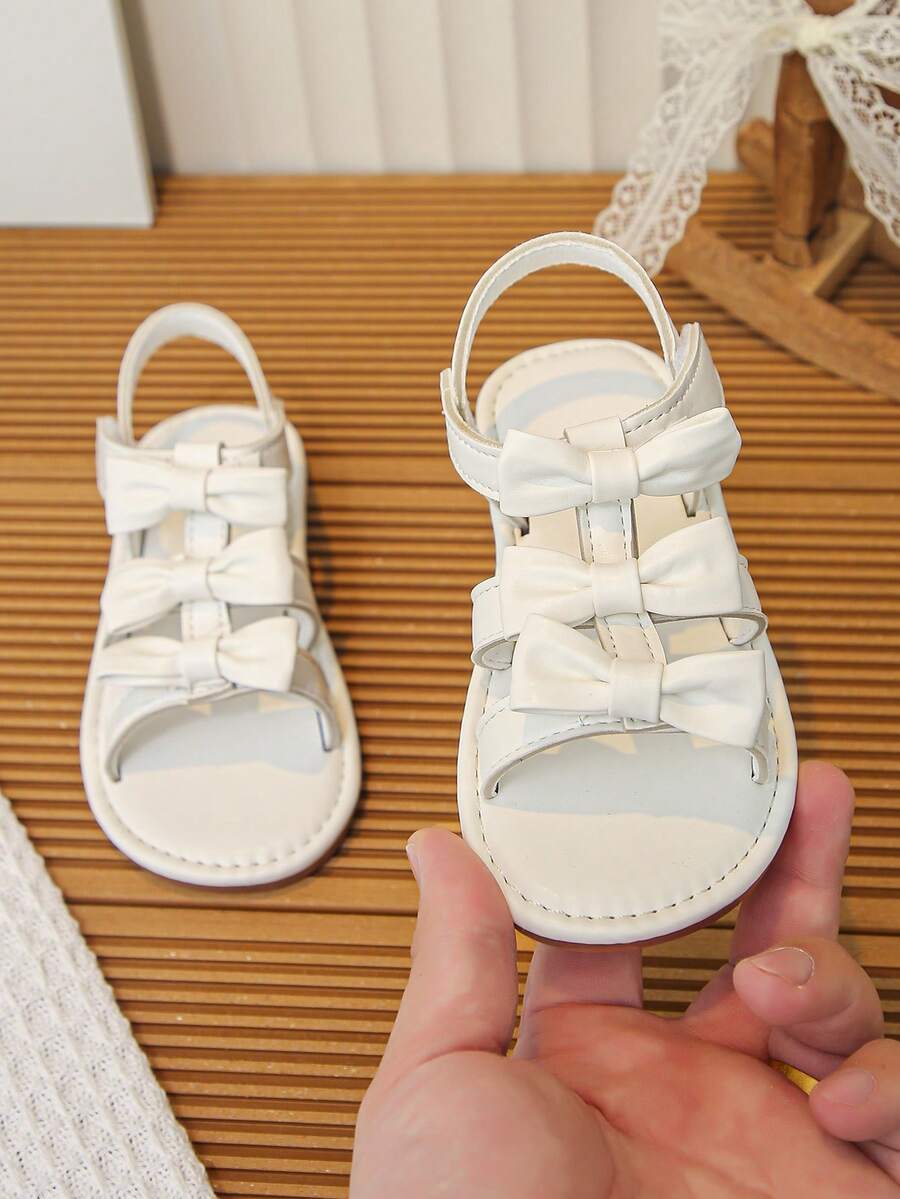 女童白色蝴蝶结公主凉鞋，软底防滑儿童夏季凉鞋 - 米色 - 查看 1
